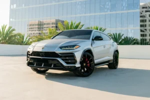 Silver Lamborghini Urus from Monza Exotics parked on a rooftop