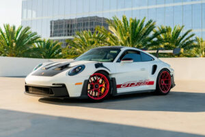 White on red Porsche 992 GT3RS with large rear wing and red wheels - Monza Exotics